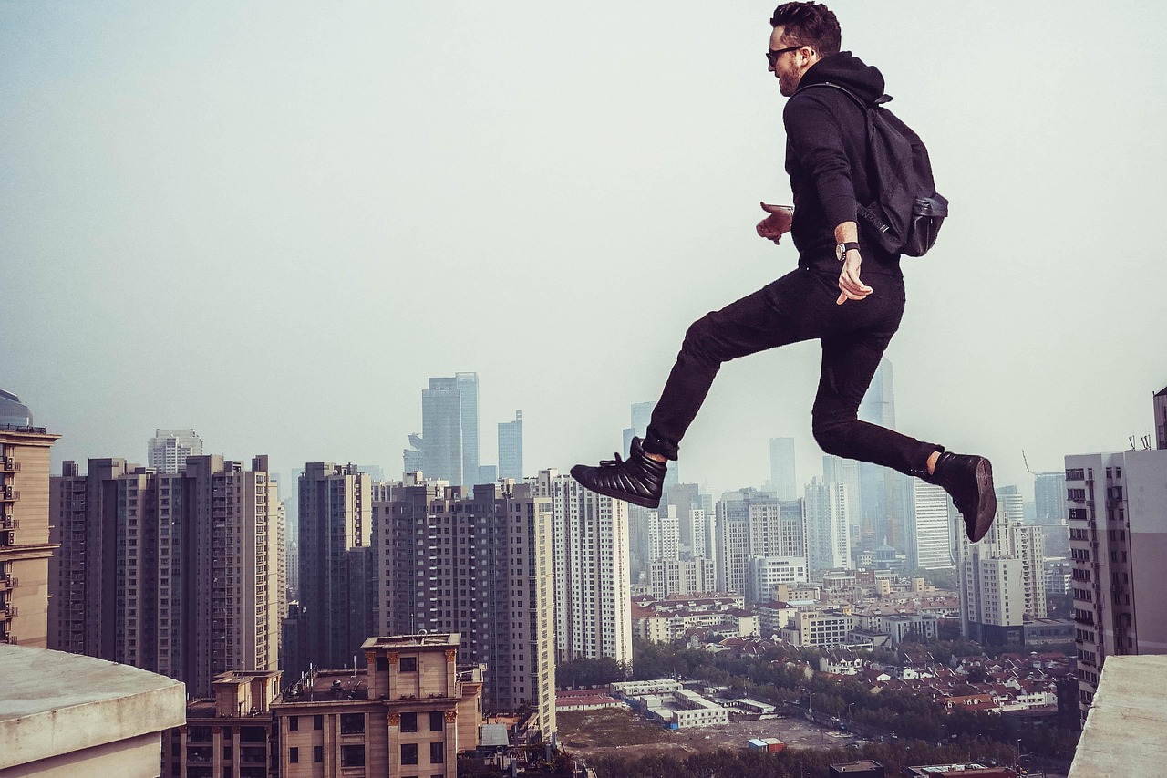 people, man, jumping, flying, sky, nature, aerial, fog, building, roof, infrastructure, establishment, urban
