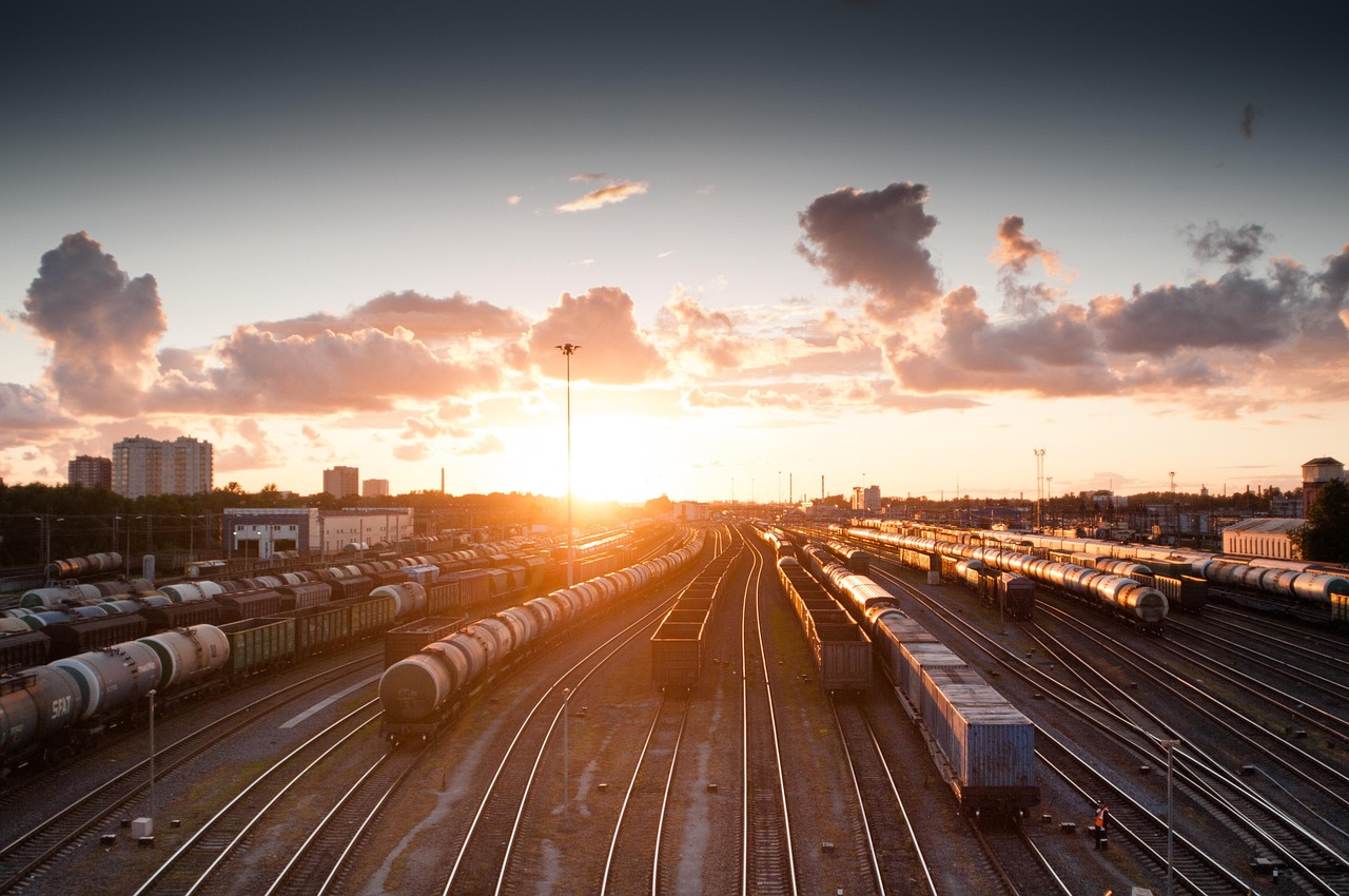 train, sunset, tracks, railroad, transportation, transport, travel, station, railway, rail, industry, platform, locomotive, traffic, technology, sky, carriage, city, speed, departure, industrial, dusk, wagon, light, transit, modern, urban, street, business, nature, delivery, subway, steel, perspective, motion, building, passenger, journey, logistic